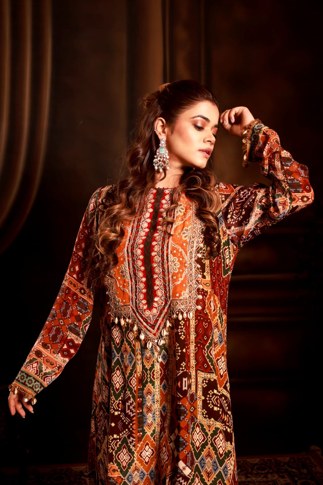 Wine color heavy neck front short back long kurta with coul pant.