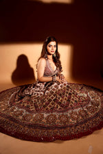 Maroon sleeveless choli with cream lehenga & heavy maroon dupatta